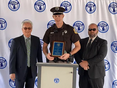 Flees and Smith accepting awards
