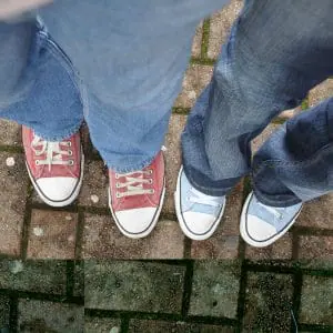 POAM Friends | Two People Wearing Red and Blue Converse Shoes