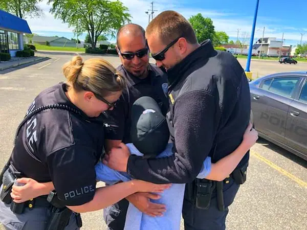 donut boy gets hugs from michigan police