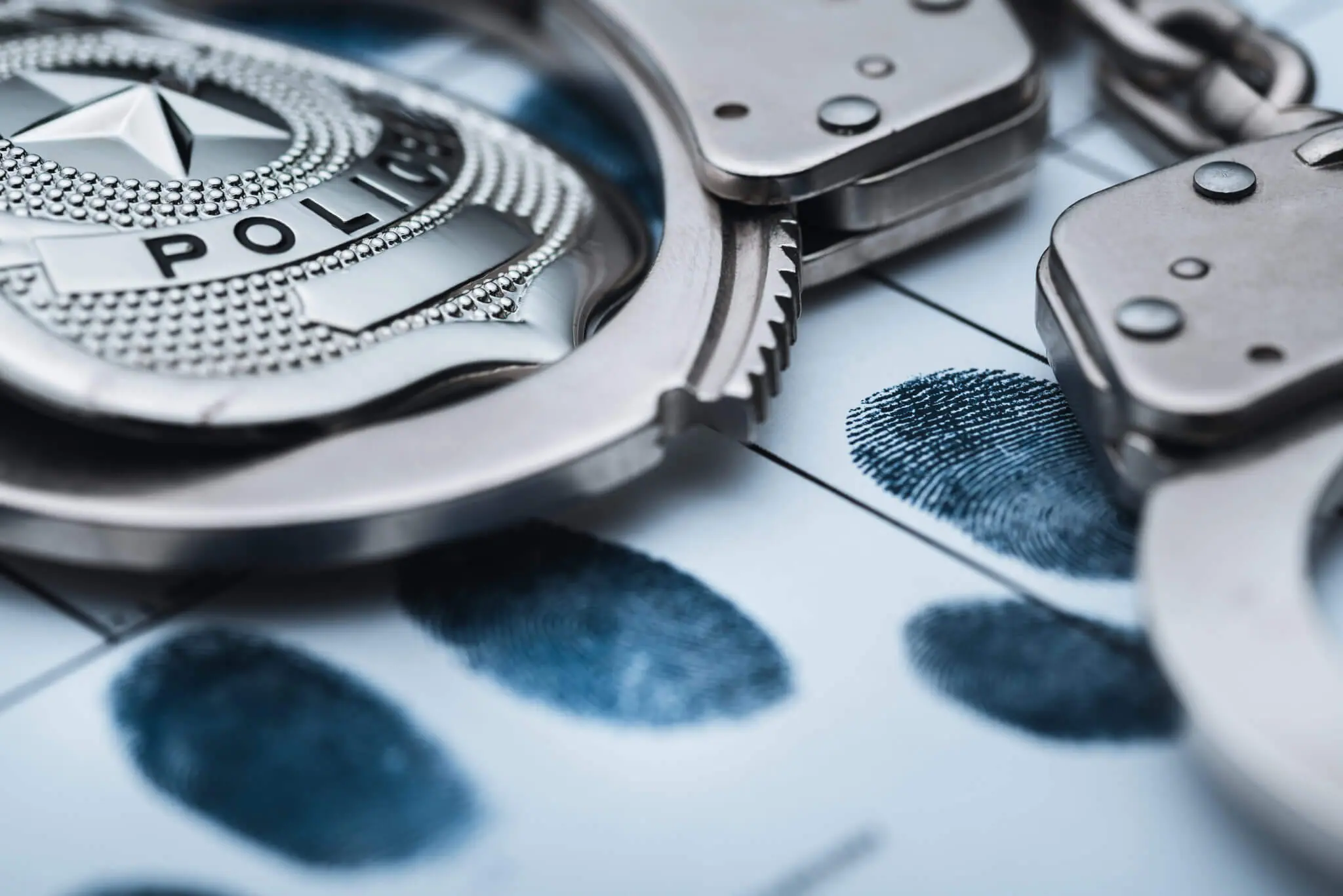 Image of police handcuffs and set of fingerprints | 2019 Police Training | Lathrup Village Police Officers | Paw Paw Police Officer career opening | City of Gibraltar Police Officer