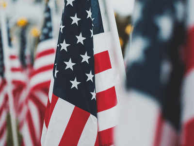 Image of an American Flag. Protecting First Responders | Hazard Pay for Law Enforcement | Peace Officers Memorial Day | Patrick Lyoya Shooting