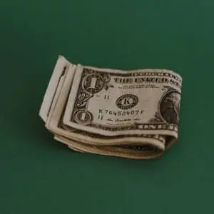 Image of one dollar bills | Retirement Income | Saving Early | Health Savings Account