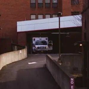 Emergency ambulance in the bay entrance of a hospital | Front Line First Responders | Executive Order 2020-153