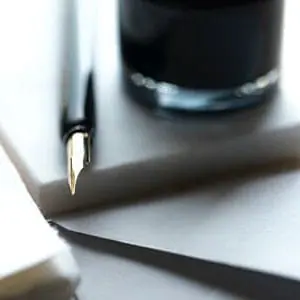 MCOLES Considers Police Reforms | Pen on slate with a black cup | 1033 Program