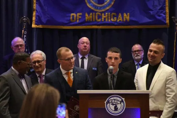 Genesee County DSA Deputies Roy, Fatching, and Clayton receiving their P.O. of the Year Awards