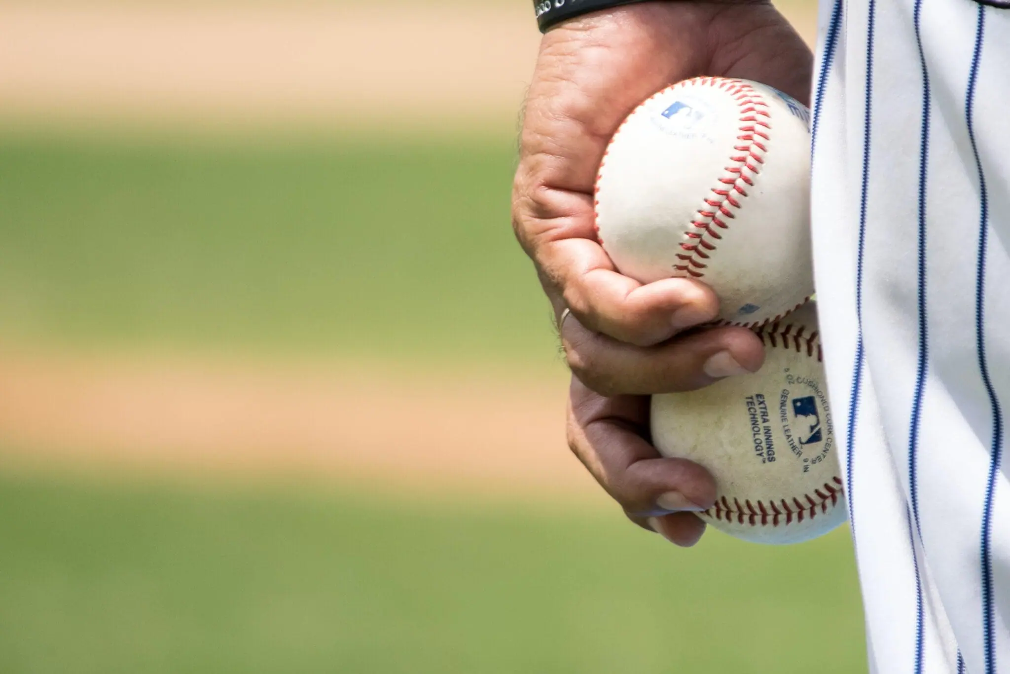 Law enforcement night - man holding baseballs