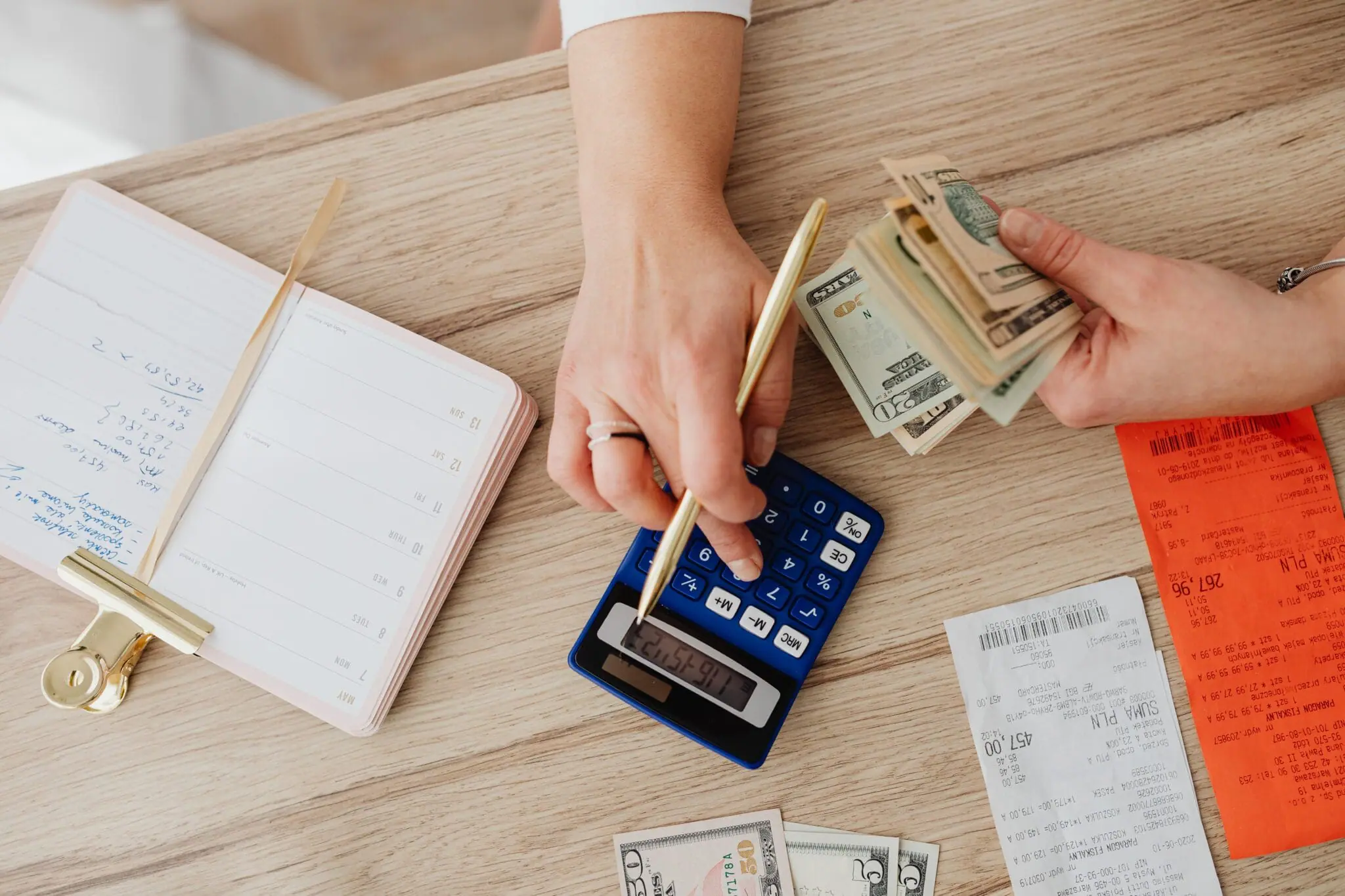 A person calculating bills | Spot Early Financial Trouble with RPA's Credit Warning Signs Checklist