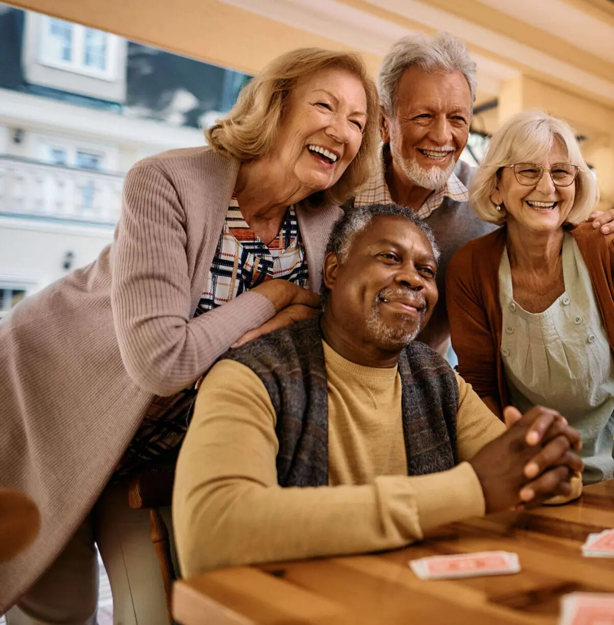 Group of elderly people are meeting to discuss retirement and are taking a selfie. Elders are speaking about the SECURE Act 2.0.
