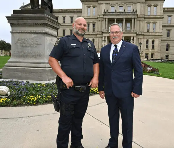 John Graver and Rep. Martin posing outside of the MI state capitol building after the 9/11 Memorial Celebration