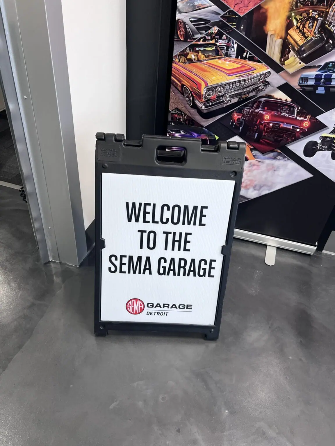 SEMA Garage Detroit Welcome Sign at the SEMA Garage Detroit Livonia Police Vehicle