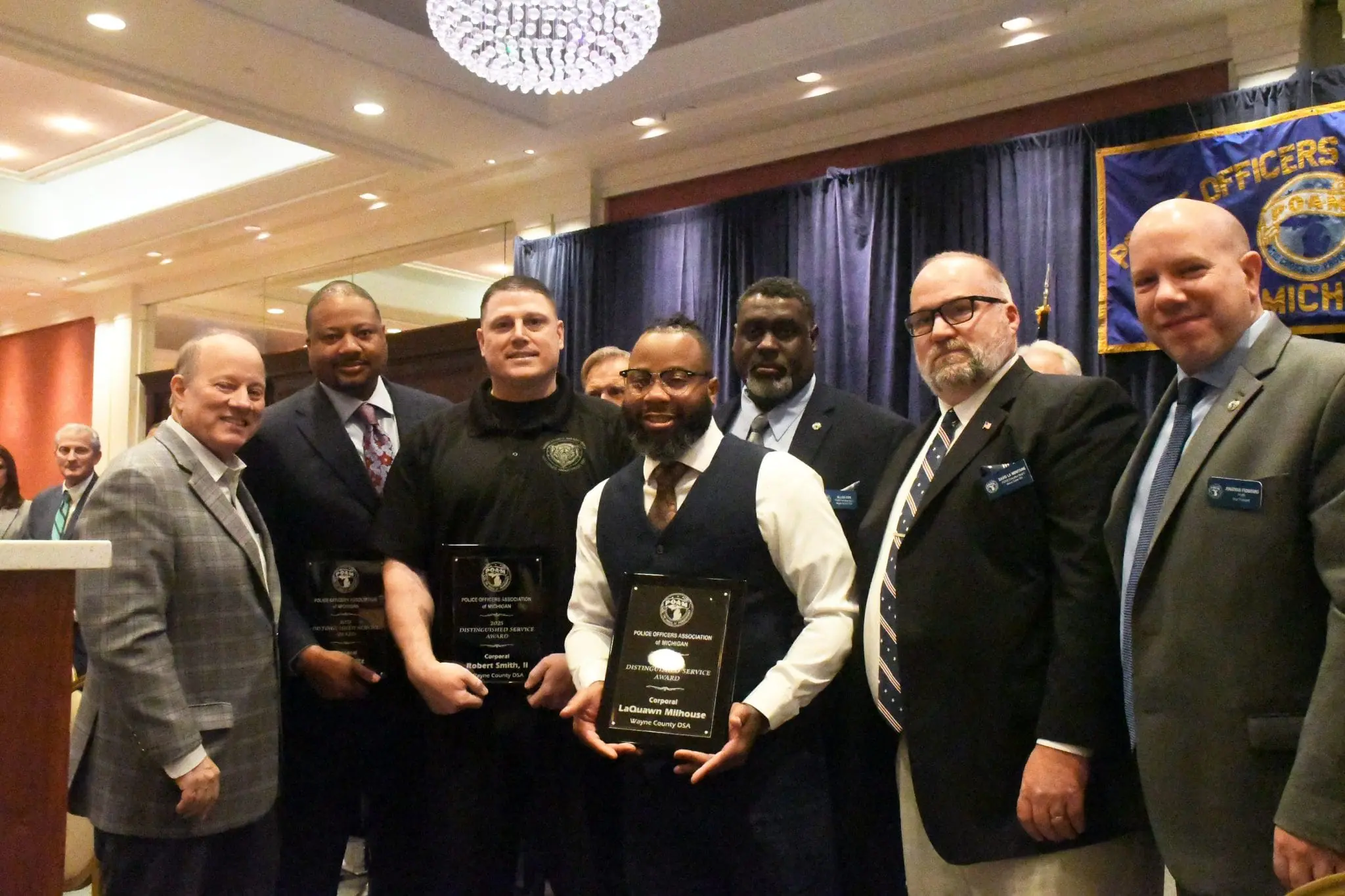 Wayne County Deputy Sheriff's Association Corporal John Pietz, Deputy LaQuawn Milhouse, and Deputy Robert Smith, III receiving the 2025 Distinguished Service Award at the POAM Annual Convention.