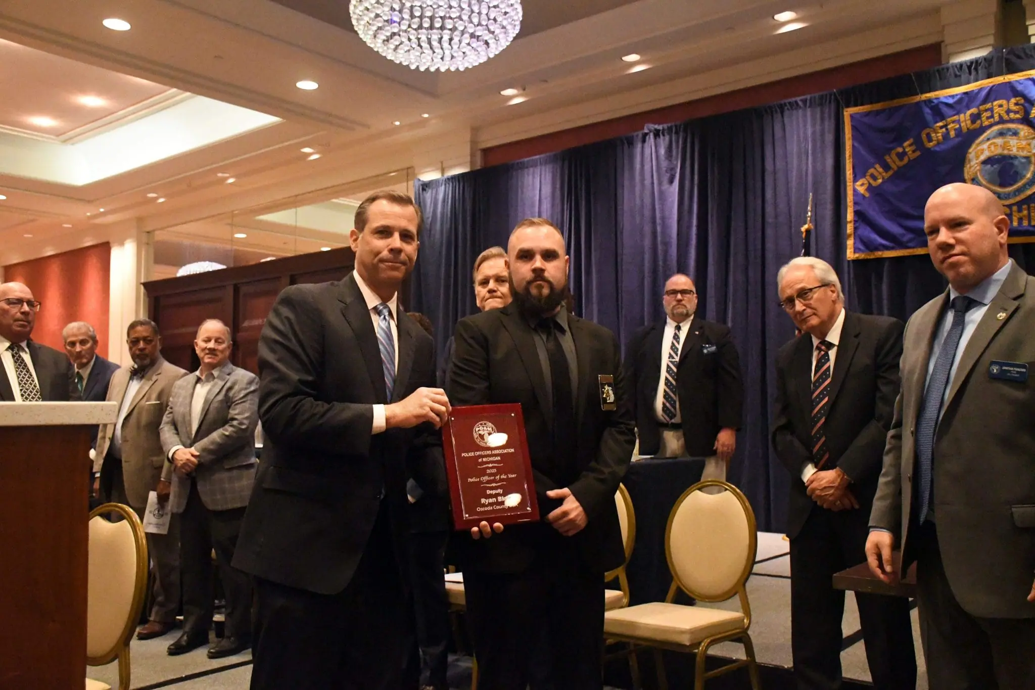 Oscoda County Deputy Ryan Blair receiving the 2025 POAM Police Officer of the Year Award.