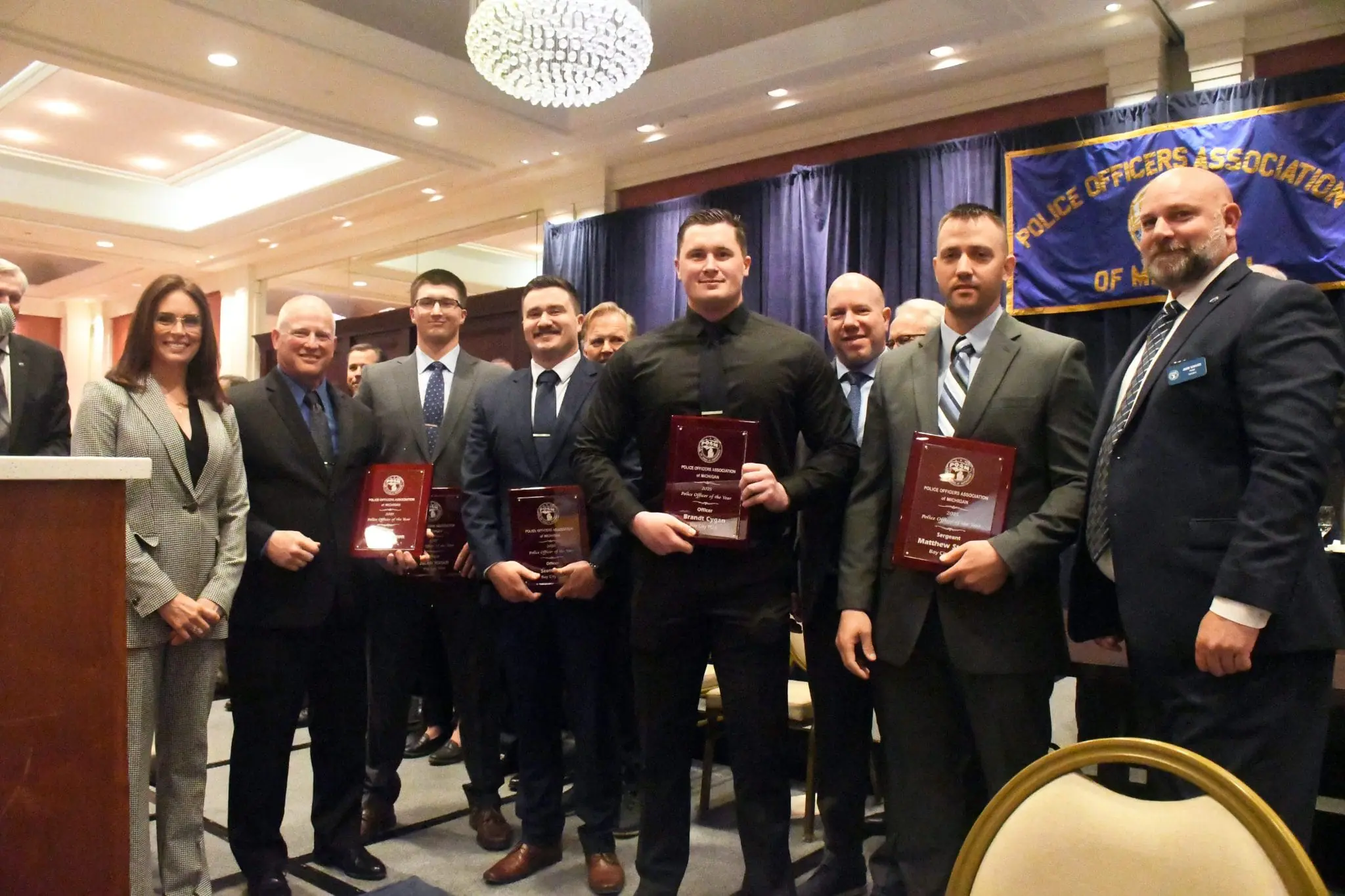 Bay City Police Officers and Command Officers Associations' Officers Jacob Kirsch, Stephen Staron, Scott Selle, Brandt Cygan, and Sergeant Matthew Strunk receiving the 2025 Police Officer of the Year Award at the POAM Annual Convention.