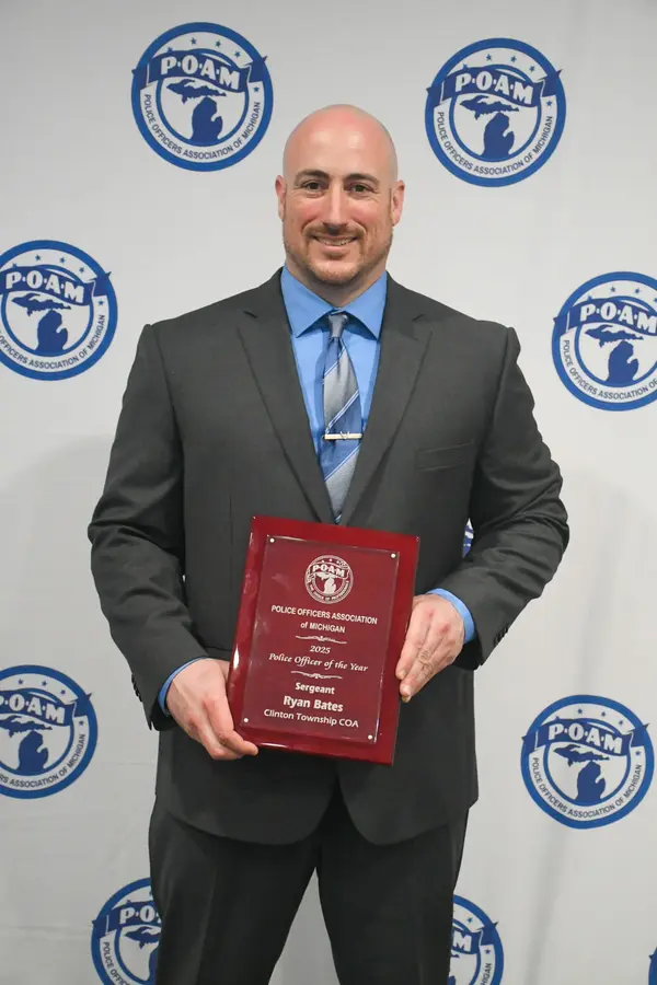 Clinton Township Police Officer Ryan Bates receiving the 2025 Police Officer of the Year Award at the POAM Annual Convention.